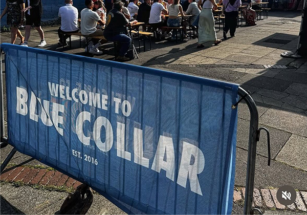 poncho crowd barrier cover with Blue Collar Event Branding