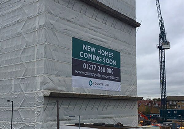 Image of PVC banner installed onto building wrap for Countryside properties