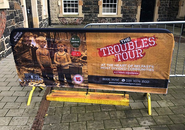 Closeup of elite crowd barrier cover printed for The Troubles Tour