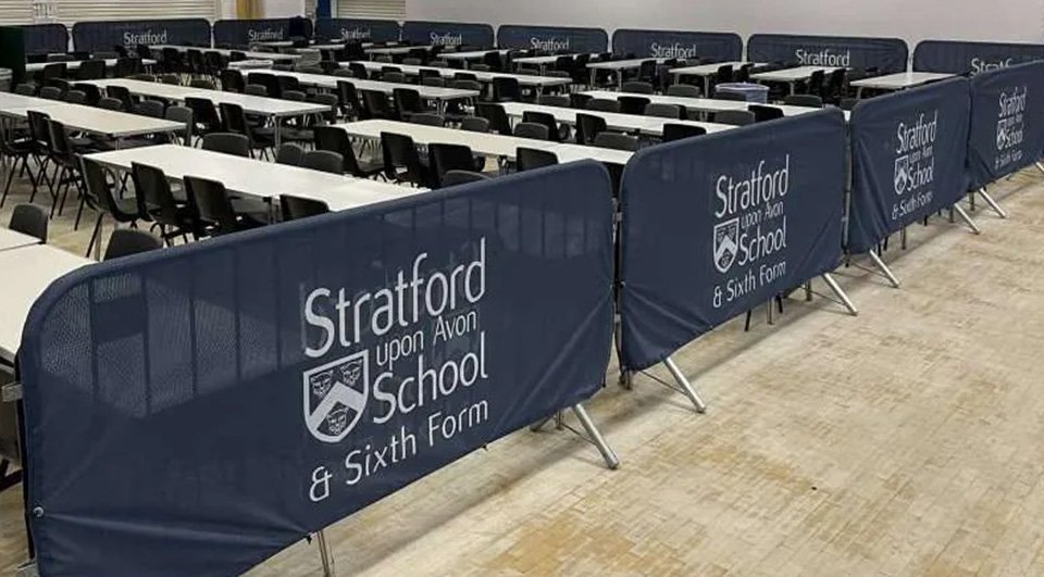 Crowd barrier covers on display at Stratford upon Avon School