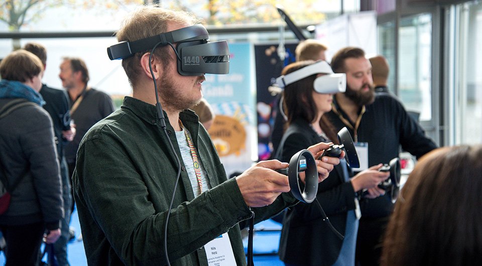 Man using VR headset at a trade show