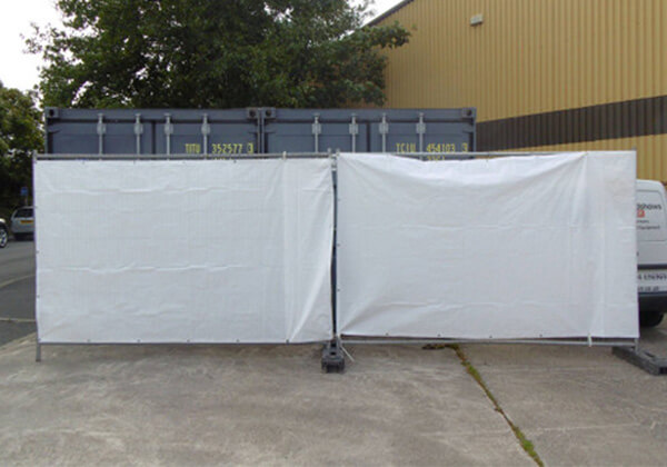 White fire retardant fence tarpaulin on display