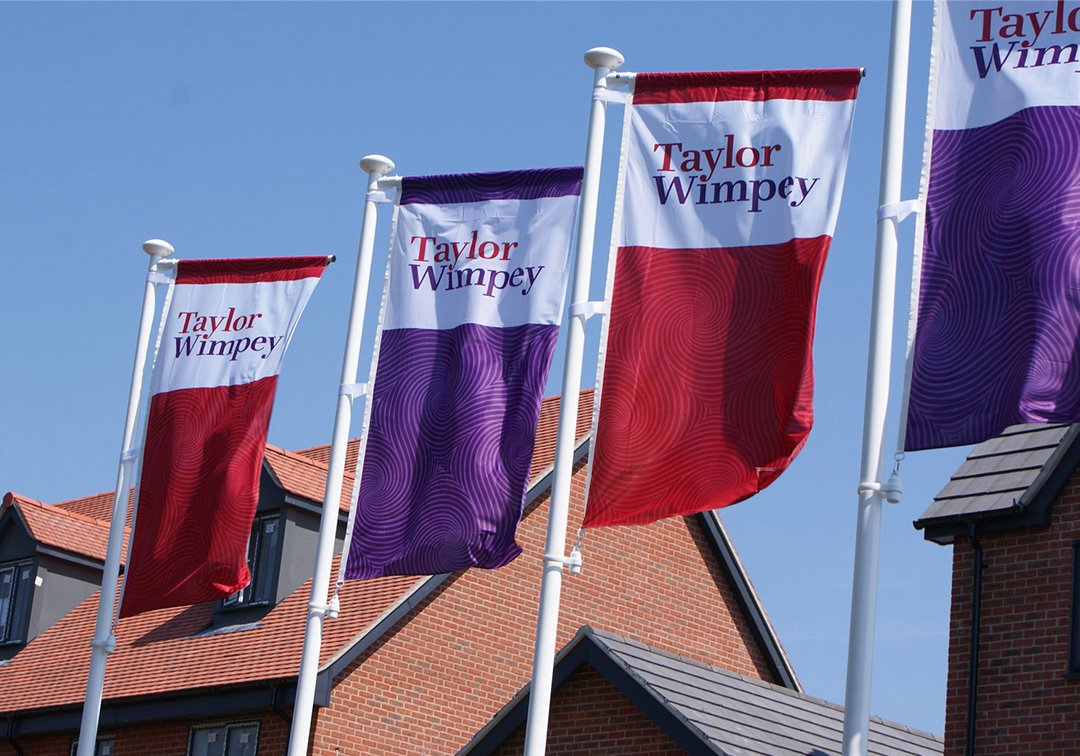 Image of showhome flagpoles for house construction brand Taylor Wimpey
