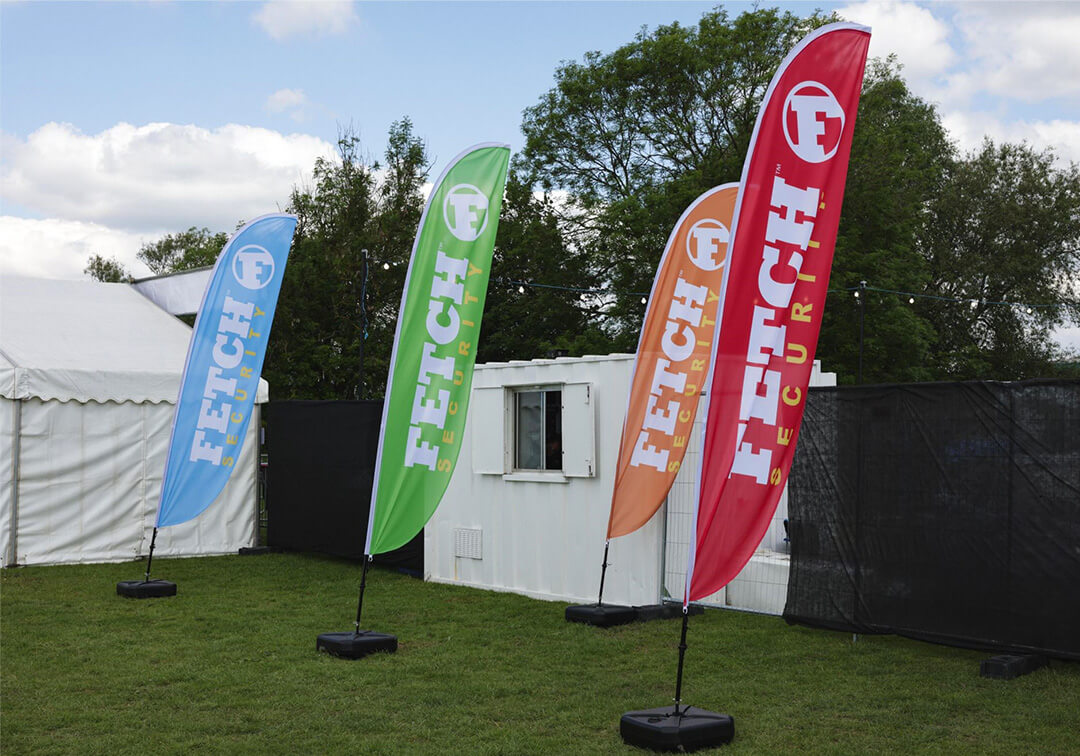 Image of printed feather flags branded with Fetch Security