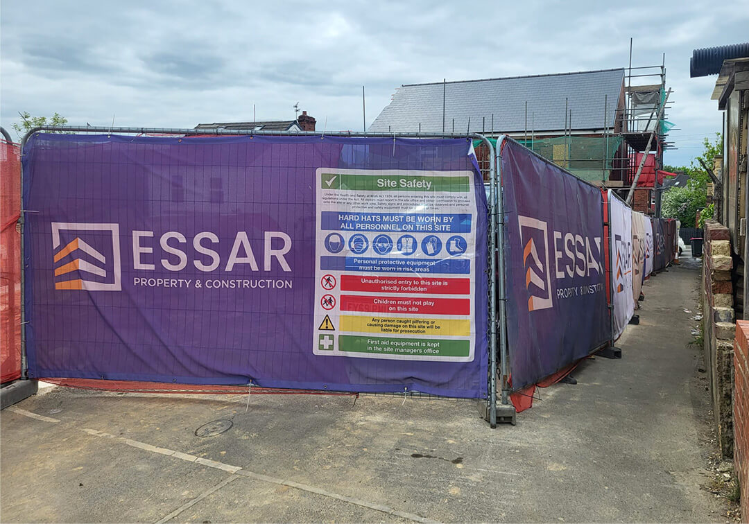 Elite Heras fence cover site branding for ESSAR Construction