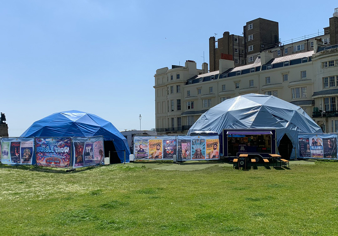 The Rotunda Theatre at Brighton Fringe surrounded by custom Heras fence covers printed by Monster Mesh.