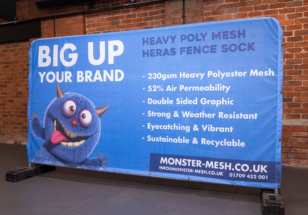 Double-sided Heras fence cover with Monster-Mesh Branding