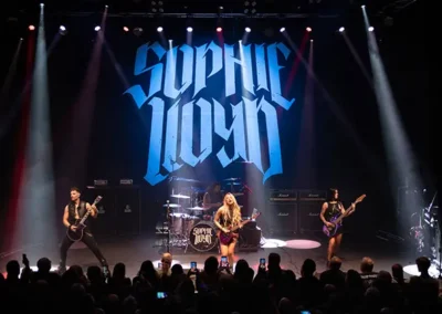 Stage backdrop on display for Sophie Lloyd guitarist