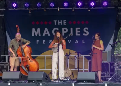 Stage backdrop branded for the Magpies Festival