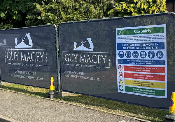 Heras Fence Covers with Guy Macey construction branding