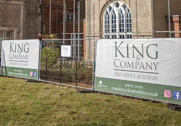 Heras fence cover with King & Company Builders branding
