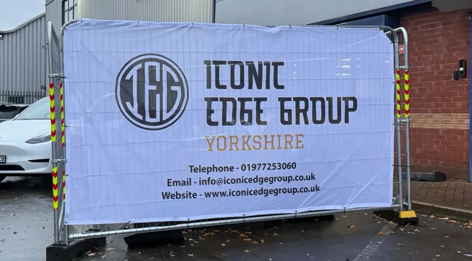Airmesh Heras fence covers with Iconic Edge Group branding