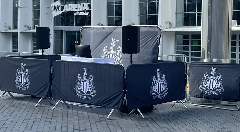 Event crowd barrier covers with Newcastle United FC branding