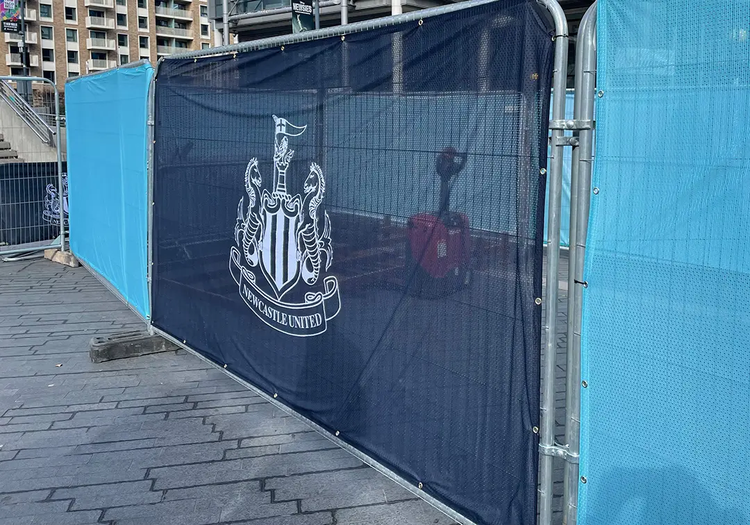 Heras fence covers branded and on display for Newcastle United FC