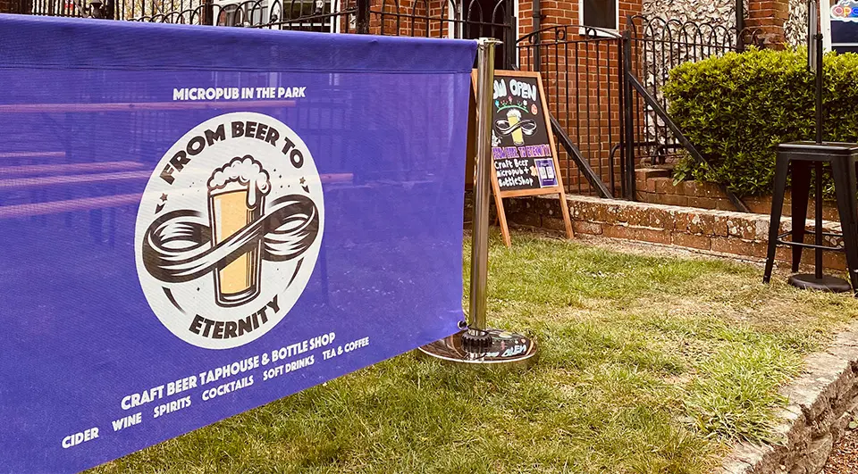 cafe-barrier-case-study-beer-to-eternity-1 Custom printed purple PVC mesh café barrier for From Beer to Eternity micropub, Havant